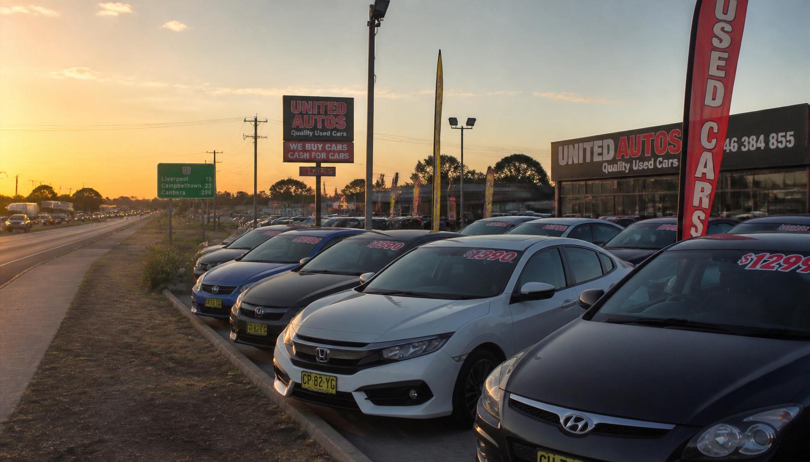 Used car dealership strip on the Hume Highway near Lansvale in south-west Sydney at golden hour